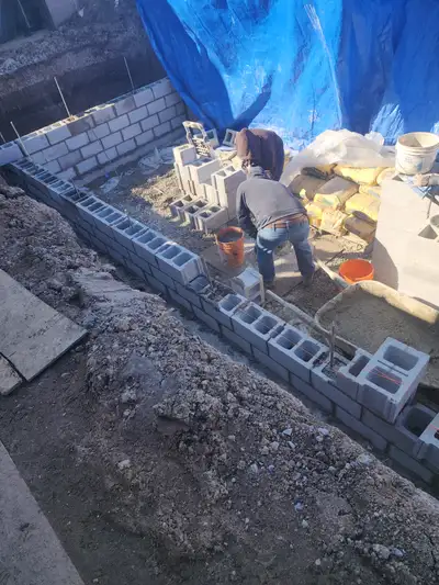 Bricks blocks concrete mansory foundatio wall cutting concrete opening underpinning shoring waterpro...