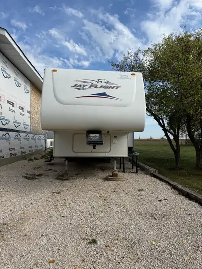 I'm selling my Jay Flight 5th wheel camper. This used camper is perfect for hitting the road. The ca...