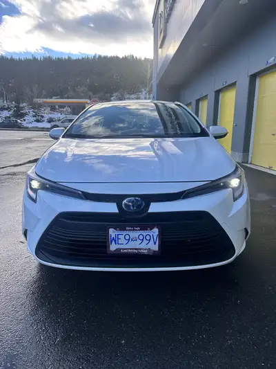 Drive in style with this sleek white 2024 Toyota Corolla, a fuel-efficient and reliable sedan with a...