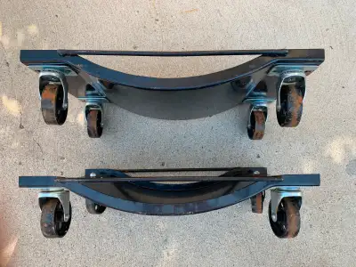 Pair of easy rolling, steel wheeled, 1000 lb capacity 14 inch wide vehicle wheel dollies in good con...