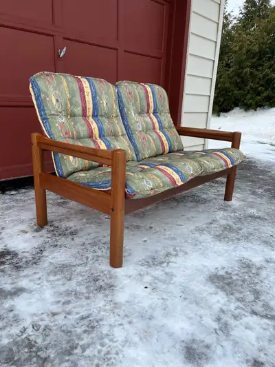Midcentury Modern Danish Teak Loveseat. Domino Mobler. In good vintage condition. Located in Braesid...