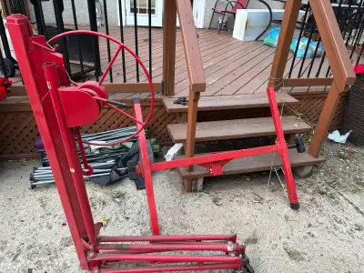 Selling a heavy-duty, red steel drywall panel lift in good working condition. This is an absolute li...