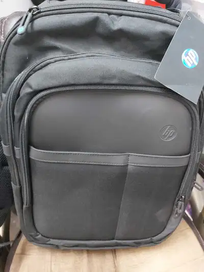 I'm selling a brand new HP laptop backpack, perfect for carrying laptops up to 17.3 inches, featurin...