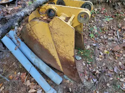 24 inch tooth bucket off john deere 710 D with 2.5" pin size and 12 inches between the ears. Like NE...