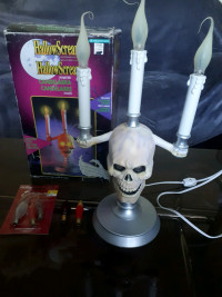 Hallowscream haunted candelabra flickering flames skull 