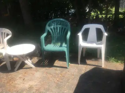 Assortment of Seven Plastic Lawn Chairs and Circular Wood Table, View more
