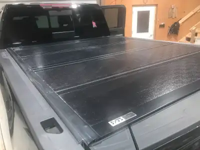 Hard tri-fold tonneau cover. Fits 2019-current Chev/GMC 2500/3500 trucks with std box. $450 OBO.