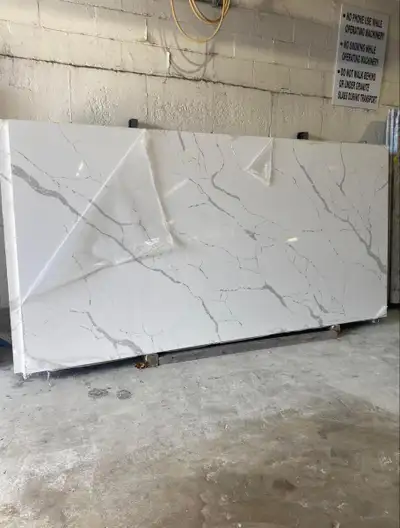 Upgrade your kitchen or bathroom with these stunning, brand-new white quartz slabs featuring elegant...
