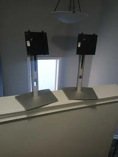 Two Dell desktop monitor mounts. Sliding height adjustment. Screwn size is post is mandatory field....