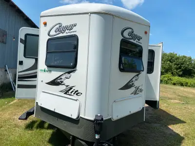 2011 - 32 ft Cougar (V - Nose style ) trailer with 2 power slide outs. Fully loaded with air, heat ,...