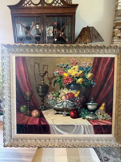 This is a painting by Hungarian artist Bela Belagh, featuring a still life of fruit and flowers. Thi...