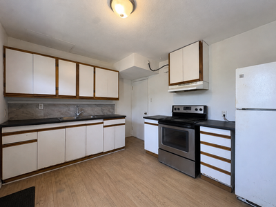 Bright and spacious rental with updated flooring, neutral paint, and plenty of natural light through...