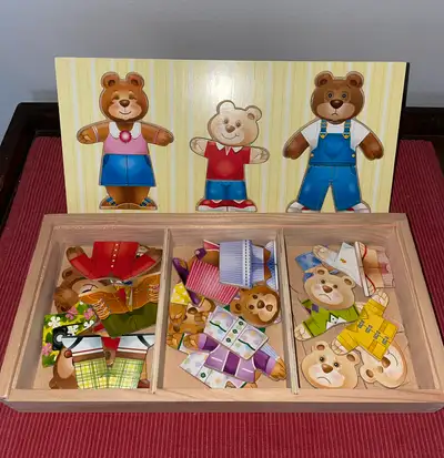 DURABLE WOODEN DRESS-UP SET: The Melissa & Doug Bear Family Dress-Up Puzzle is a durable wooden set...