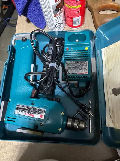 Makita cordless drill with battery and charger and metal case, View more