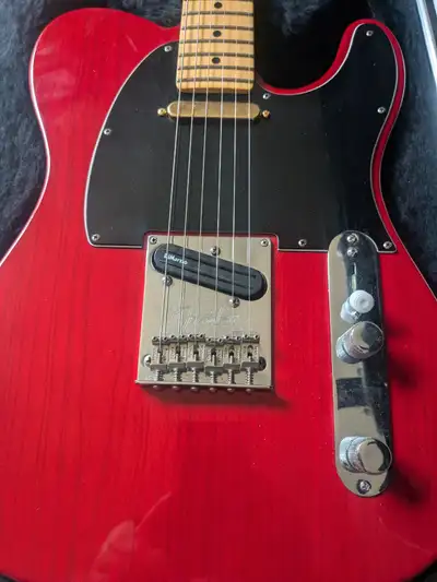 Beautiful Tele with the transparent finish. Joyfully LIGHT and easy to play. Set up really well. Upg...