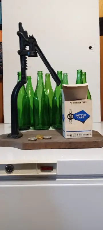 Vintage bottle capper, 8 bottles, and 1/2 box of new caps included.