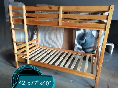 This is a used wood bunk bed, perfect for kids or a guest room. It's sturdy and in good condition. D...