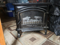 Electric fire place  wrks great,  on wheels, ceramic top