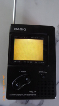 CASIO Handheld Mini LCD Television TV-7, with Ear Pod; Remote