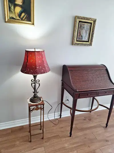 Beautiful wrought iron base lamp with burgundy shade. Sq 1 location