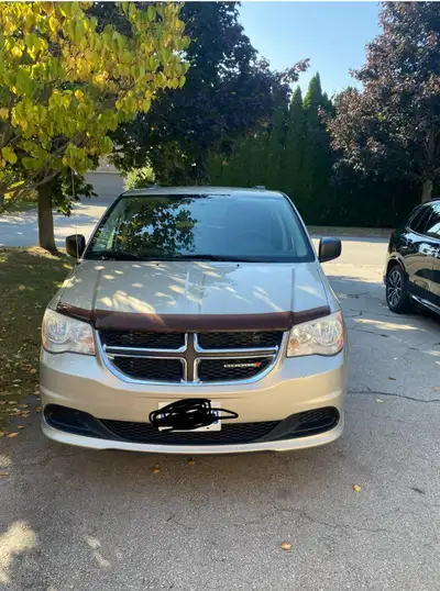 2014 Dodge Grand Caravan. Reliable and drives well. Only needs a windshield and probably new tires....