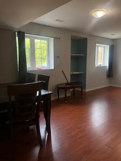 This pre-owned basement offers a comfortable and practical living space with wood-style laminate flo...