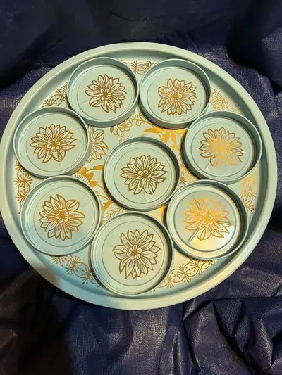 Elevate your retro decor with this vintage tray and coaster set, featuring a light blue colour with...
