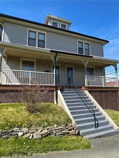 A side by side duplex with main level and upstairs. 3 Bedrooms are upstairs and kitchen and living a...