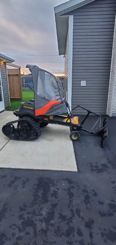 Cubcadet zero turn mower with tracks and plow for winter