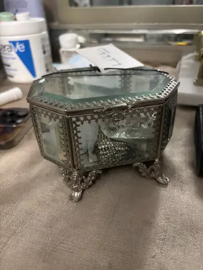 Add a touch of elegance to your vanity with this used Nicole Miller Home octagon glass jewellery box...