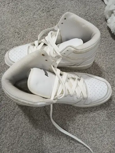 PUMA Rebound V6 sneakers feature a high-top design, View more