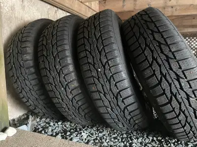 Complete set of 175/65R15 studded winter tires and rims. The rims are off a Honda and are included i...