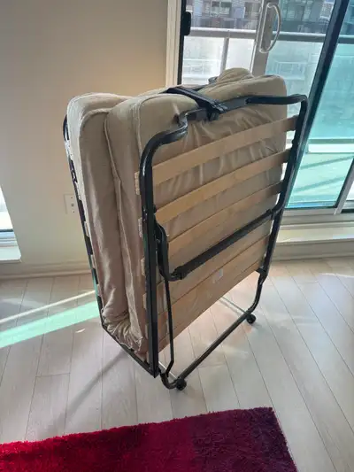 Twin size rollaway bed Width; 32 inches and Height: 44 inches (folded) Width: 32 inches and Height:...