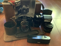 Vintage Camera Canon AE-1 with Case, Flash, and Three Lenses