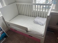 IKEA crib toddler bed with mattress and sheets
