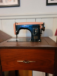 Vintage "Golden Rule" sewing machine in cabinet