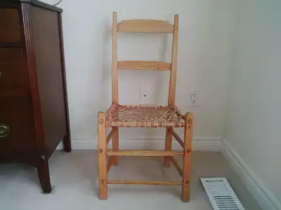 Vintage handmade rustic chair with woven leather seat., View more