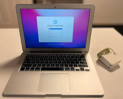 2015 Apple MacBook Air. Battery holds a small charge but should be replaced. Works fine plugged into...