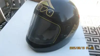 See pics. Helmet is smaller sized (S 55) so best suited for a smaller or younger rider. Velcro strap...