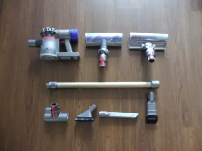 Dyson V8 Animal Cordless Stick Vacuum with attachments for sale. Approximately 4 years old ; good co...