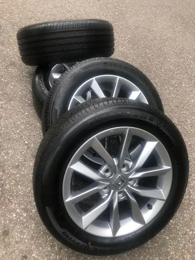 Offering for sale a Great set for Honda Civic Firestone all season tires 215/55R16 on NEW Honda orig...