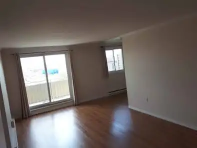Beautiful clean spacious two bedroom condo for rent on top floor of a corner 7 story building in Whi...