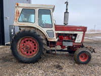 International 1066 tractor with blade