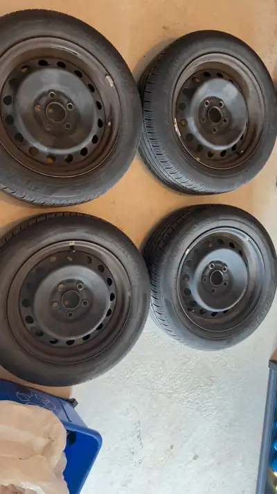 Selling all season tires and rims from a Honda civic 215/55R16