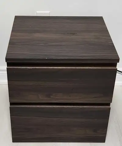This 2 drawer chest offers a sleek and modern storage solution for your bedroom with its dark wood-e...