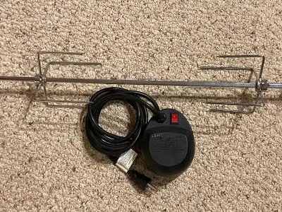 Never used 30” BBQ rotisserie spit with an electric motor. Asking $30 for both items. Pick up in nor...