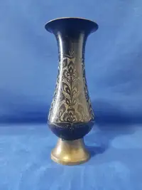 Vintage metallic flower vase with hand craft art work on it