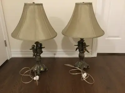 A pair of vintage Cherub lamps, appear to made of solid brass,, View more
