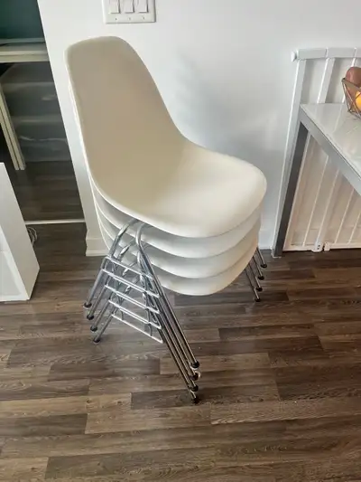 Authentic Charles & Ray Eames molded plastic side chair manufactured by Vitra. White polypropylene s...