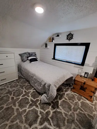 Bdrm with dresser, bed, window, share bathroom with 1 person, shared kitchen, lovely backyard backin...